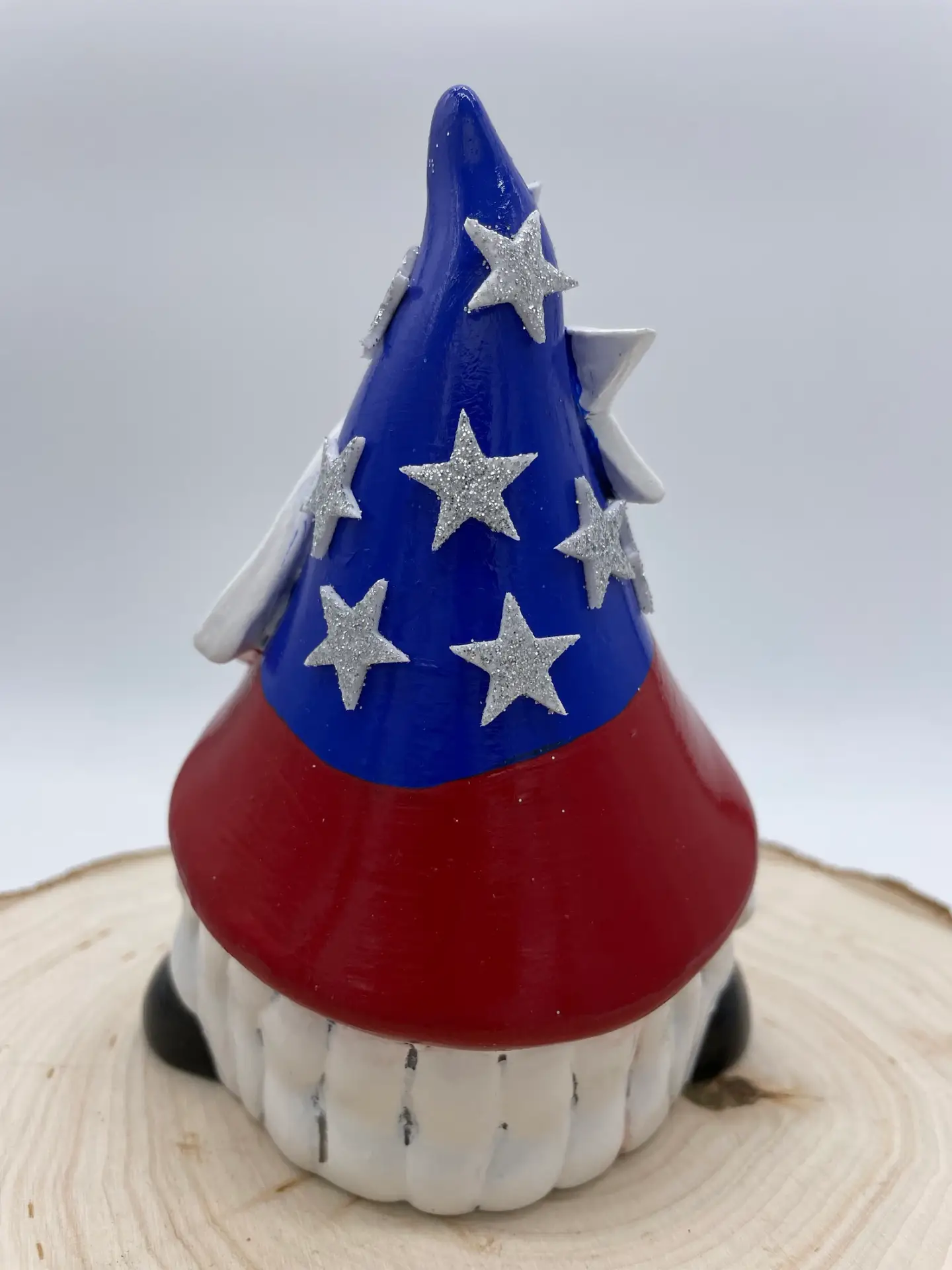 Birthday Gnome for the month of July wearing Red, White, and Blue hat, with silver stars, Back