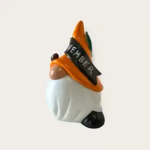 Birthday Gnome for November with Orange hat and leaf accessories, Left