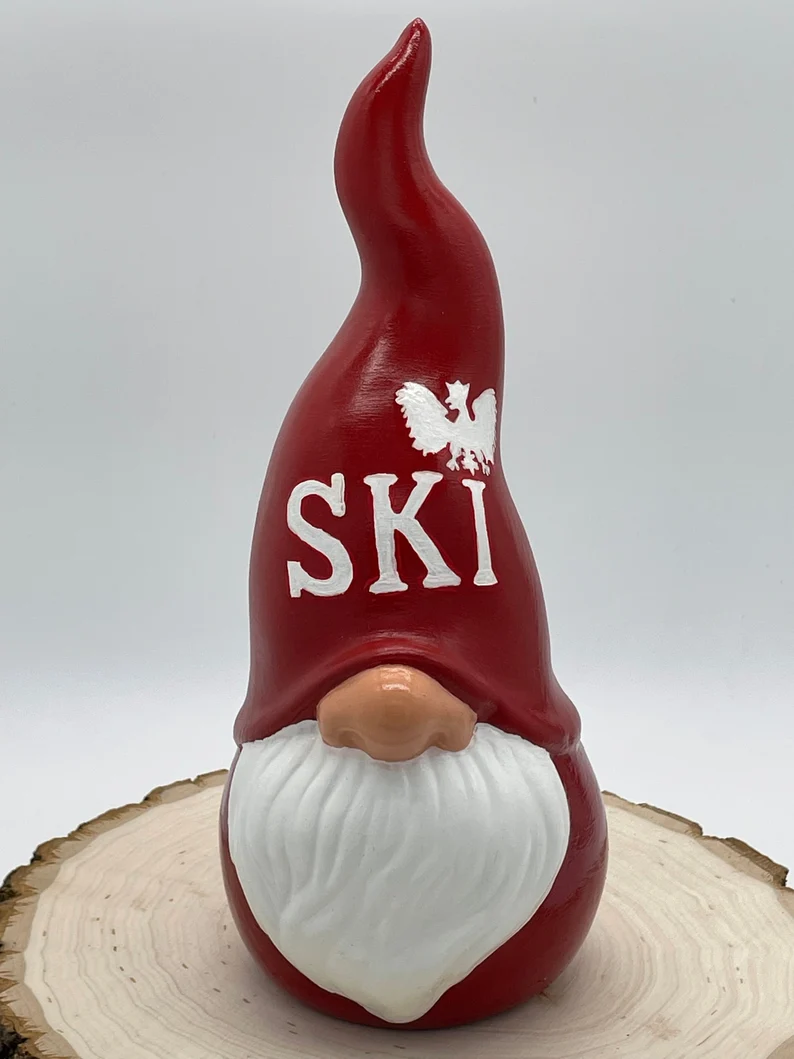 Ceramic Garden Gnome with red hat and clothes, hat says 'Ski' in white with the Polish Eagle above the letter I, Front