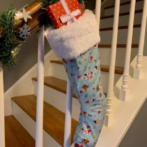 Full light blue Gnome Christmas Stocking with gifts inside, hanging on banister, Front Angle 2